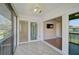 Sunroom features ceiling fan, hexagonal tile flooring, and sliding glass doors open to the living area at 5201 Lake Village Dr # 14, Sarasota, FL 34235