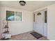 Home entryway features a welcome mat, tile floors and an ornate door with side panel at 5522 Yorkshire Way, Sarasota, FL 34231