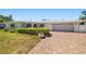 Charming single-story home with a well-manicured lawn, brick driveway, and an attached two-car garage at 5522 Yorkshire Way, Sarasota, FL 34231