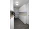 Utility room with abundant storage cabinets, shelving, and vinyl plank flooring at 5522 Yorkshire Way, Sarasota, FL 34231