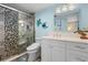 Bathroom with stone tiled shower, modern fixtures and updated vanity at 600 Sutton Pl # 104, Longboat Key, FL 34228