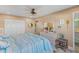 Bedroom showcasing beach theme décor, dresser, and closet space at 600 Sutton Pl # 104, Longboat Key, FL 34228