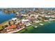 Waterfront estate featuring a pool and private boat dock, nestled in a picturesque coastal setting at 606 Crestwood Ln, Holmes Beach, FL 34217