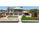 Backyard featuring a luxurious pool, outdoor kitchen, and spacious entertainment area at 606 Crestwood Ln, Holmes Beach, FL 34217