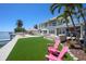 Wonderful outdoor oasis with a pristine pool, cozy fire pit, and breathtaking waterfront views at 606 Crestwood Ln, Holmes Beach, FL 34217