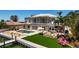 Spacious backyard with a private pool, outdoor kitchen, and scenic waterfront views at 606 Crestwood Ln, Holmes Beach, FL 34217