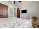 Bedroom with flat screen television and coastal decor at 606 Crestwood Ln, Holmes Beach, FL 34217