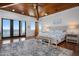 Beautiful main bedroom with wood ceiling, water view balcony, and stylish decor at 606 Crestwood Ln, Holmes Beach, FL 34217