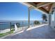 Expansive outdoor deck overlooking waterfront, perfect for entertaining at 606 Crestwood Ln, Holmes Beach, FL 34217