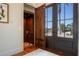 Modern elevator with wood interior and views of the outdoors from the entrance at 606 Crestwood Ln, Holmes Beach, FL 34217