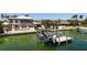 Waterfront home with boat lift and outdoor entertaining areas at 606 Crestwood Ln, Holmes Beach, FL 34217