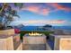 Enjoy evenings by the water with a built-in fire pit and custom seating at 606 Crestwood Ln, Holmes Beach, FL 34217