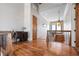 Hallway featuring wood floors, desk, lamp, staircase and view of outside at 606 Crestwood Ln, Holmes Beach, FL 34217