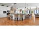 Large kitchen with white cabinetry, granite countertops, a center island, and stainless steel appliances at 606 Crestwood Ln, Holmes Beach, FL 34217
