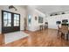 Bright foyer with rich hardwood floors leading to a modern, stylish living area and open floor plan at 606 Crestwood Ln, Holmes Beach, FL 34217