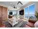 Light filled living room with stunning ocean views and modern coastal decor at 606 Crestwood Ln, Holmes Beach, FL 34217