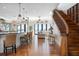 Spacious living room with waterfront views, a staircase, and an open floor plan at 606 Crestwood Ln, Holmes Beach, FL 34217