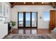 Living room with hardwood floors, waterfront view and access to outdoor deck at 606 Crestwood Ln, Holmes Beach, FL 34217