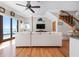Open living space with staircase and views of the water, blending indoor and outdoor living at 606 Crestwood Ln, Holmes Beach, FL 34217