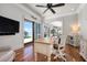 Cozy office with hardwood floors, built-in shelving, and sliding door to the backyard at 606 Crestwood Ln, Holmes Beach, FL 34217