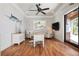 Bright office with hardwood floors, ceiling fan, and a door to the outside at 606 Crestwood Ln, Holmes Beach, FL 34217