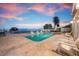 Beautiful waterfront pool with outdoor seating at 606 Crestwood Ln, Holmes Beach, FL 34217