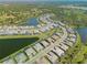 Aerial view of the residential community showcasing the lush landscaping, lake views, and inviting streetscapes at 6172 Lungo Lago Dr, Sarasota, FL 34241