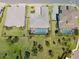 Aerial view of the neighborhood and property, highlighting the pool and backyard at 6172 Lungo Lago Dr, Sarasota, FL 34241