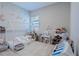 Charming bedroom with decor, decorative wall features, carpet, and a window at 6172 Lungo Lago Dr, Sarasota, FL 34241