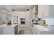 Gourmet kitchen with a gas range, stainless appliances, and custom cabinetry at 6172 Lungo Lago Dr, Sarasota, FL 34241