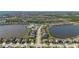 An aerial view of a beautiful home located between two ponds in a gated community at 6410 Rosehill Farm Run, Bradenton, FL 34211