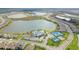 Aerial view of the community with multiple amenities and lakes, showcasing a vibrant and well-planned neighborhood at 6410 Rosehill Farm Run, Bradenton, FL 34211