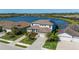 An aerial view of a beautiful two-story home with a water view and community at 6410 Rosehill Farm Run, Bradenton, FL 34211