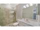 Clean bathroom with a glass shower, updated fixtures, and a mirrored vanity, offers a fresh modern appeal at 6410 Rosehill Farm Run, Bradenton, FL 34211