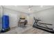 Bright bedroom with ceiling fan, desk, exercise equipment, and neutral paint at 6410 Rosehill Farm Run, Bradenton, FL 34211