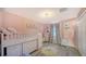 Cozy pink bedroom with bunk beds, a closet, and a charming sun rug at 6410 Rosehill Farm Run, Bradenton, FL 34211