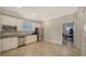 Spacious kitchen with stainless steel appliances, granite countertops, and ample cabinet space for storage at 6410 Rosehill Farm Run, Bradenton, FL 34211
