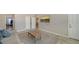 Bright living room featuring stylish decor, a cozy sofa, and a decorative coffee table with a relaxing atmosphere at 6410 Rosehill Farm Run, Bradenton, FL 34211