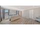 Spacious main bedroom featuring light gray walls, wood-look floors, and abundant natural light at 6410 Rosehill Farm Run, Bradenton, FL 34211