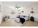 Bedroom with neutral walls, ceiling fan, and updated lighting that creates a warm ambiance at 6639 16Th N St, St Petersburg, FL 33702