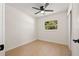 Clean bedroom offers ceiling fan, light flooring and large window for plenty of natural light at 6639 16Th N St, St Petersburg, FL 33702