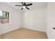 Bright bedroom with ceiling fan and light laminate flooring at 6639 16Th N St, St Petersburg, FL 33702