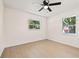 Bedroom featuring neutral walls, ceiling fan, and large windows at 6639 16Th N St, St Petersburg, FL 33702