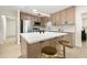 Modern kitchen featuring stainless steel appliances, an island, and sleek wood-tone cabinetry at 6639 16Th N St, St Petersburg, FL 33702