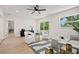 Bright living room featuring modern furniture, recessed lighting, ceiling fan, and large sliding glass doors at 6639 16Th N St, St Petersburg, FL 33702