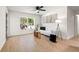 Bright living room featuring hardwood floors, ample natural light, and a modern sofa at 6639 16Th N St, St Petersburg, FL 33702