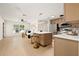 Open-concept living space featuring a modern kitchen, bright living room and hardwood floors at 6639 16Th N St, St Petersburg, FL 33702