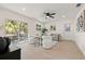 Bright living room with recessed lighting, ceiling fan, and sliding glass door that brings the outdoors in at 6639 16Th N St, St Petersburg, FL 33702