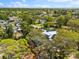 Stunning aerial view of a home with mature trees, highlighting its proximity to community amenities at 6811 6Th W St, Bradenton, FL 34207
