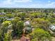 Lovely aerial image of a home nestled in a verdant neighborhood, showcasing its charming surroundings at 6811 6Th W St, Bradenton, FL 34207